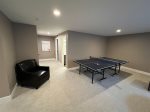 Endless Fun Awaits in the Family Room with Our Ping-Pong Table - Perfect for Rainy Day Entertainment